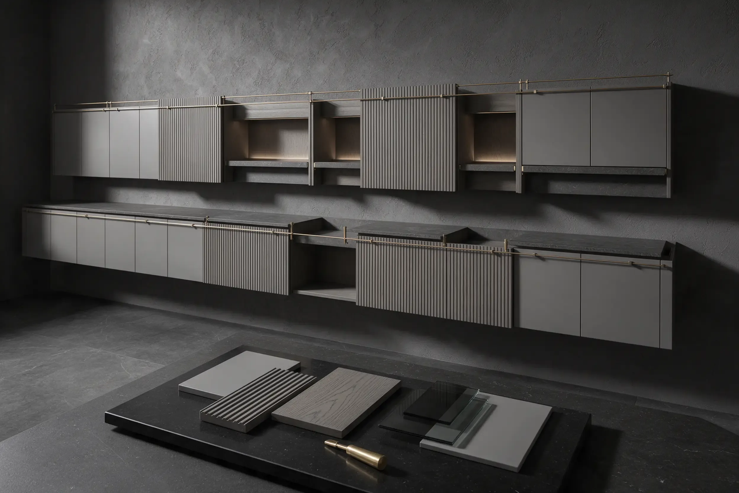 Finish samples laid out on a dark table: fluted oak, grey lacquer, dark stone and brass, fitted cabinets behind