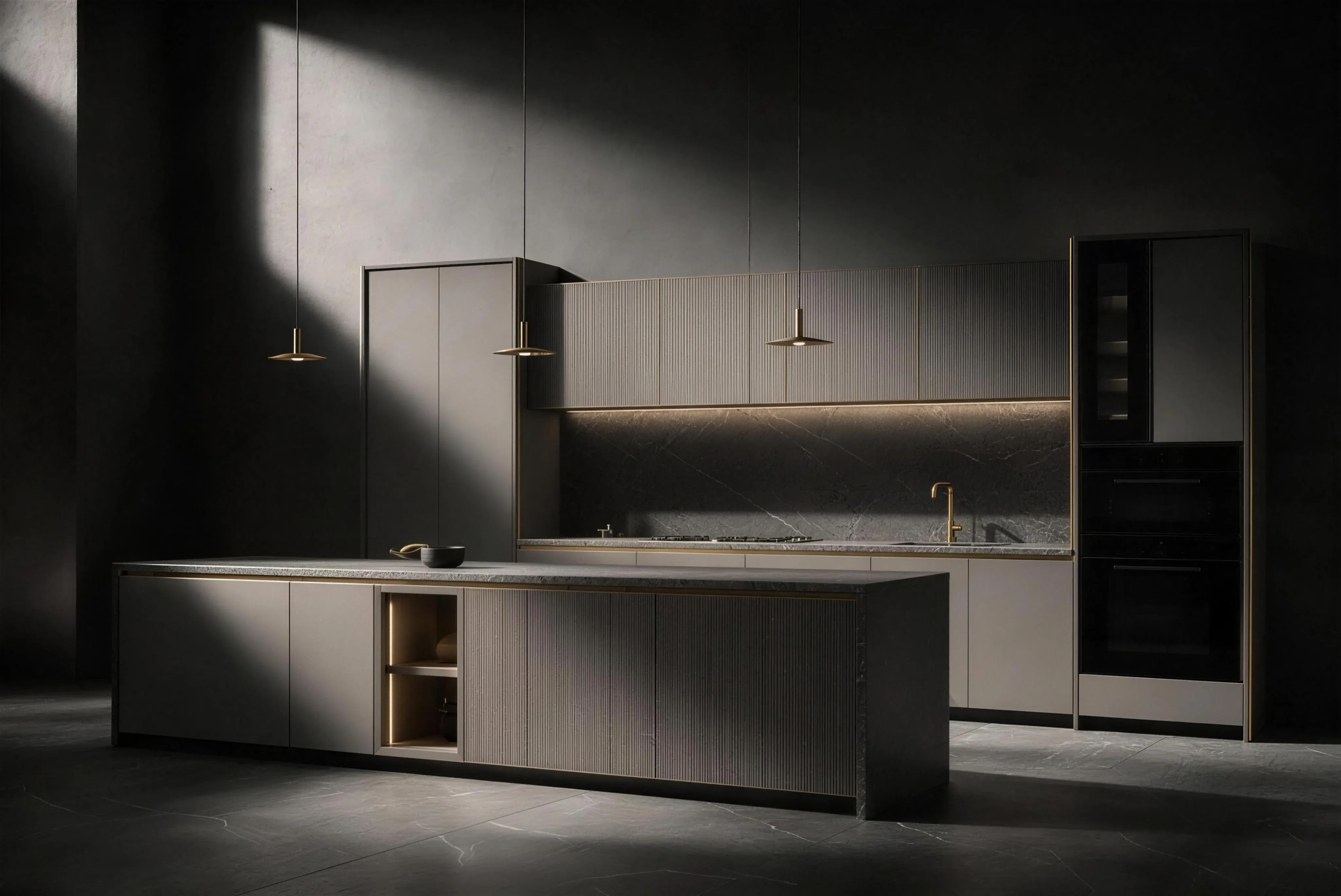 A fitted kitchen in a dark villa room: a stone island, a run of grey fronts and two tall appliance columns under pendant lights